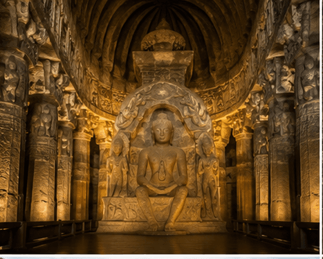A seated Buddha carved in a cave sanctuary