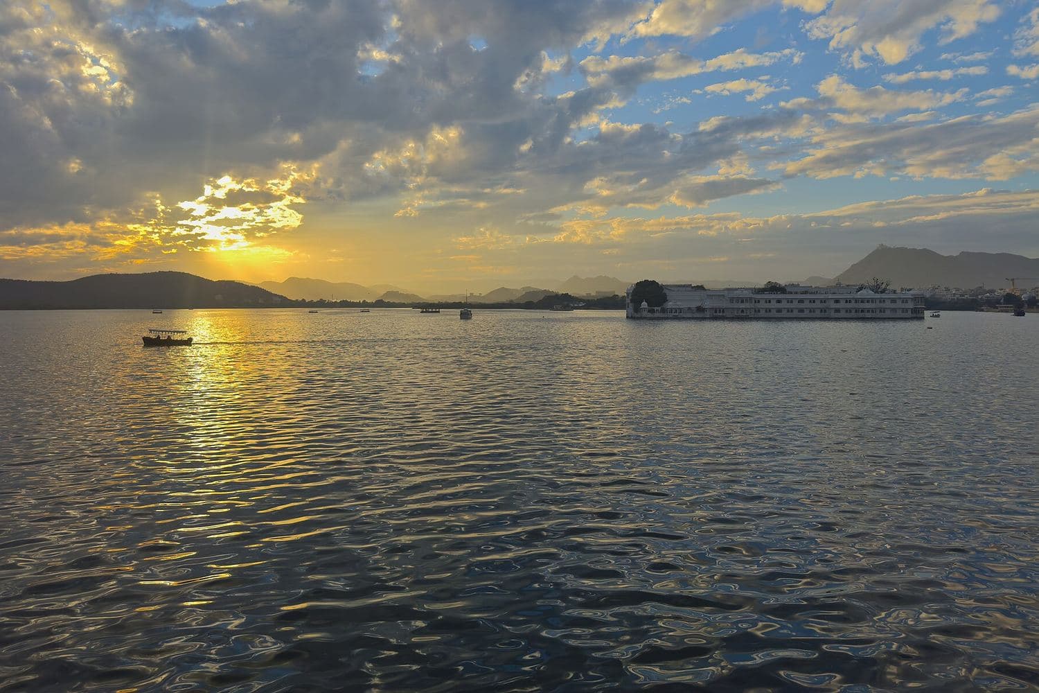 Sunset over Lake Pichola in Udaipur, with the Lake Palace on the water